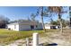 Backyard of a newly built home with a well and other houses visible at 232 Locust Pass, Ocala, FL 34472