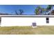 Rear view of a newly constructed home with AC unit at 232 Locust Pass, Ocala, FL 34472