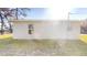 Side view of a newly built home with a window and electrical box at 232 Locust Pass, Ocala, FL 34472