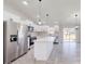 Modern kitchen with white cabinets and a large island at 232 Locust Pass, Ocala, FL 34472