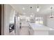 Stainless steel appliances and white cabinetry in this kitchen at 232 Locust Pass, Ocala, FL 34472