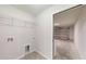 Laundry room with built-in shelving and access to the garage at 232 Locust Pass, Ocala, FL 34472