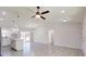 Bright living room with tile floors and ceiling fan at 232 Locust Pass, Ocala, FL 34472