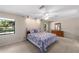 Large bedroom with carpeted floors and ceiling fan at 3590 Sw 24Th Avenue Rd, Ocala, FL 34471