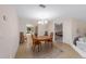 Bright dining room with a wood table and chairs, offering an open floor plan at 3590 Sw 24Th Avenue Rd, Ocala, FL 34471