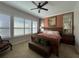 Spacious bedroom with a king-size bed and plantation shutters at 3642 Nw 55Th Cir, Ocala, FL 34482