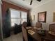 Bright dining room with dark wood table and chairs, near sliding doors at 3642 Nw 55Th Cir, Ocala, FL 34482