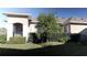 Backyard view of a tan house with black fence and tree at 3642 Nw 55Th Cir, Ocala, FL 34482