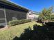 Screened porch with a view of the backyard and landscaping at 3642 Nw 55Th Cir, Ocala, FL 34482