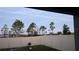 Backyard featuring a white fence with an outlook of trees and the sky at 547 Tanaro Ln, Haines City, FL 33844