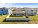 Aerial view of fenced backyard with a lawn at 547 Tanaro Ln, Haines City, FL 33844