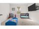 bedroom with toys, a crib, and a TV mounted on the wall at 547 Tanaro Ln, Haines City, FL 33844