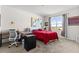 Bright bedroom boasts a large window and a dedicated desk area for work or study at 547 Tanaro Ln, Haines City, FL 33844