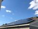 View of house rooftop with installed solar panels at 547 Tanaro Ln, Haines City, FL 33844