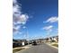 Residential street view with well-maintained homes and clear blue skies at 547 Tanaro Ln, Haines City, FL 33844