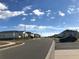 Street view of a residential neighborhood with well-maintained homes and blue sky at 547 Tanaro Ln, Haines City, FL 33844