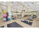 Bright and airy gym with ample workout equipment, perfect for community fitness classes at 10886 Sw 90Th Ter, Ocala, FL 34481