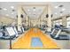 Spacious gym with modern equipment and hardwood floors, perfect for any fitness enthusiast at 10886 Sw 90Th Ter, Ocala, FL 34481