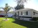 Charming single-story home with a well-manicured lawn and decorative landscaping at 11354 Sw 138Th Pl, Dunnellon, FL 34432