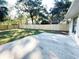 Spacious backyard with concrete patio and wooden fence at 12467 Se 62Nd Ave, Belleview, FL 34420