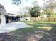 Large backyard with fenced perimeter and patio area at 12467 Se 62Nd Ave, Belleview, FL 34420