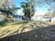 Large grassy backyard with mature trees and privacy fence at 12467 Se 62Nd Ave, Belleview, FL 34420