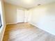 Well-lit bedroom with light walls and wood-look floors at 12467 Se 62Nd Ave, Belleview, FL 34420