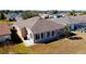 A sunroom addition with a concrete patio creates a versatile backyard living space at 16331 Sw 12Th Ter, Ocala, FL 34473