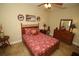 Bedroom featuring a ceiling fan, painted walls and tile flooring at 16331 Sw 12Th Ter, Ocala, FL 34473