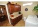 Well-lit laundry room with granite countertops, cabinetry and decorative accents at 16331 Sw 12Th Ter, Ocala, FL 34473