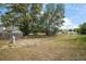 A spacious backyard area with a gas line and a neighboring fence ensures privacy and utility at 176 Pine Crse, Ocala, FL 34472