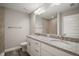 Bathroom features double vanity with granite countertop, white cabinetry, and tile flooring at 176 Pine Crse, Ocala, FL 34472