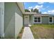 The front entrance, with a well-maintained landscape and a freshly painted door at 176 Pine Crse, Ocala, FL 34472
