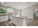 Neutral open concept living space features wood-look floors, recessed lighting, and an eat-in area at 176 Pine Crse, Ocala, FL 34472