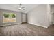 Inviting living room featuring a bright window and stylish hardwood flooring at 176 Pine Crse, Ocala, FL 34472