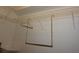 Organized closet with metal shelving and a hanging rod for clothes at 6688 Sw 113Th Pl, Ocala, FL 34476