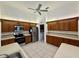 A spacious kitchen featuring tile floors, stainless steel appliances, and ample cabinet space at 6688 Sw 113Th Pl, Ocala, FL 34476