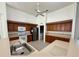 Traditional kitchen featuring wood cabinets, stainless steel appliances, and tiled floor at 6688 Sw 113Th Pl, Ocala, FL 34476