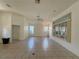Expansive living space with vaulted ceilings, neutral walls, and large windows for natural light at 6688 Sw 113Th Pl, Ocala, FL 34476