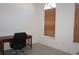 Office featuring a desk, rolling chair, and a window with blinds at 6688 Sw 113Th Pl, Ocala, FL 34476