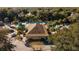 Aerial view of a community pool area with a lounge area surrounded by lush landscaping at 6688 Sw 113Th Pl, Ocala, FL 34476