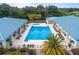 Aerial shot of a community pool featuring lounge chairs and landscaping at 6688 Sw 113Th Pl, Ocala, FL 34476