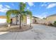 Charming single-story home with a well-manicured yard and driveway that lead to a one car garage at 1106 Liendo Ln, The Villages, FL 32162