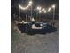 Relaxing backyard firepit area, perfect for evenings with string lights and seating at 538 Bahia Circle Ter, Ocala, FL 34472