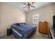 Comfortable guest bedroom with a queen-size bed and ample closet space at 5425 Se 44Th Cir, Ocala, FL 34480