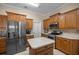 Kitchen with stainless steel appliances and wood cabinets at 5425 Se 44Th Cir, Ocala, FL 34480