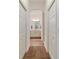 Hallway view of bathroom with double closets at 8706 Sw 88Th Pl, Ocala, FL 34481