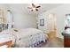 Comfortable main bedroom features neutral carpeting and a ceiling fan at 8706 Sw 88Th Pl, Ocala, FL 34481