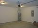 Clean garage interior featuring new water heater at 13024 Ne 6 Pl, Silver Springs, FL 34488