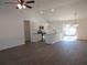 Open-concept kitchen with stainless steel appliances, granite countertops, and hardwood floors at 13024 Ne 6 Pl, Silver Springs, FL 34488